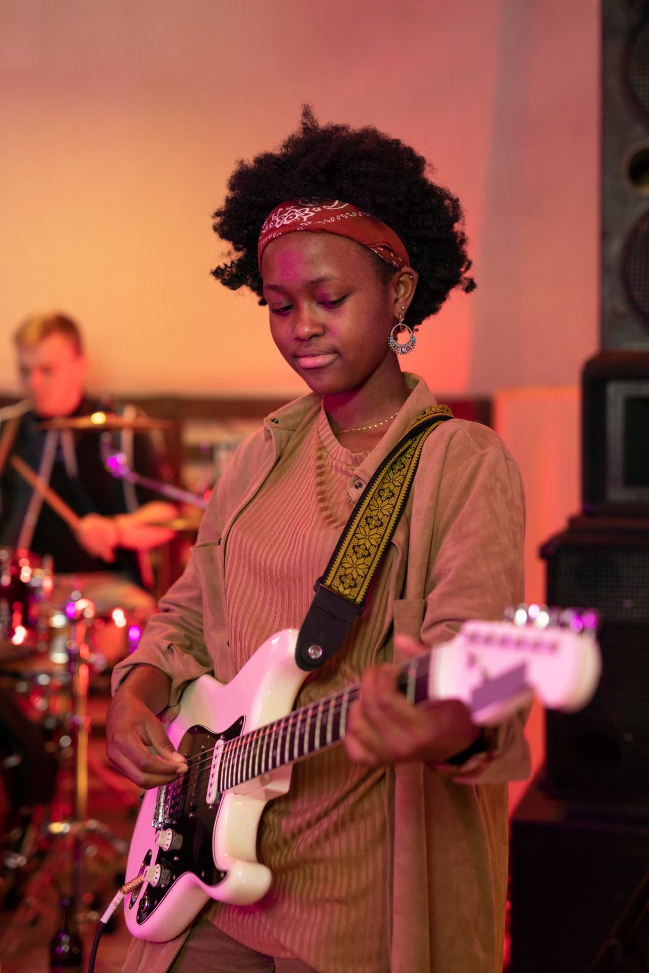A musician playing guitar on stage
