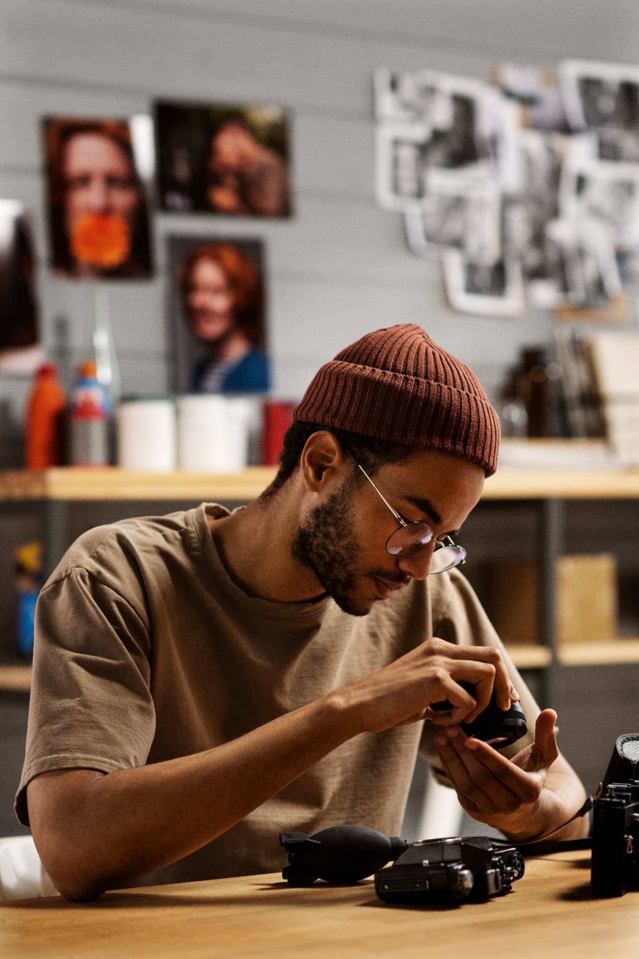 A photographer working on a camera
